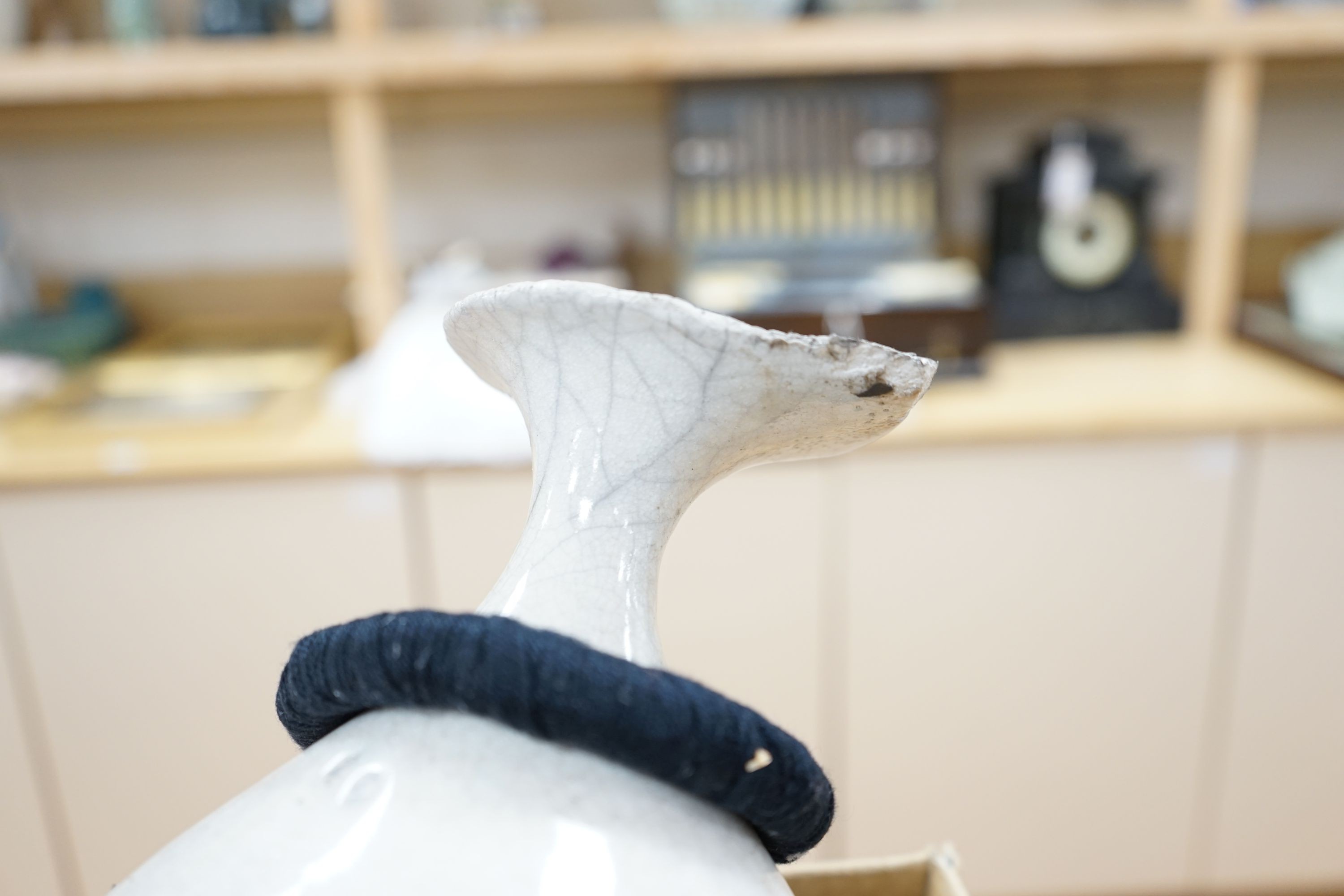 Studio pottery- an Allison Weightman raku fired large albastron form vase, ovoid vase and cup and a Petra Reynolds oval stoneware pot (4) Tallest 44cm